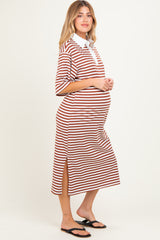 woman wearing a brown and white striped maternity dress with a collared neckline and side slits, showing her baby bump