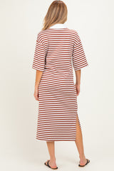 woman wearing a red and white striped maternity maxi dress with short sleeves and a side slit.