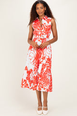 woman wearing a red and white floral midi dress with a collared neckline and a fitted waist