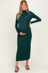 woman wearing a dark green long sleeve maternity dress with a fitted silhouette and baby bump visible