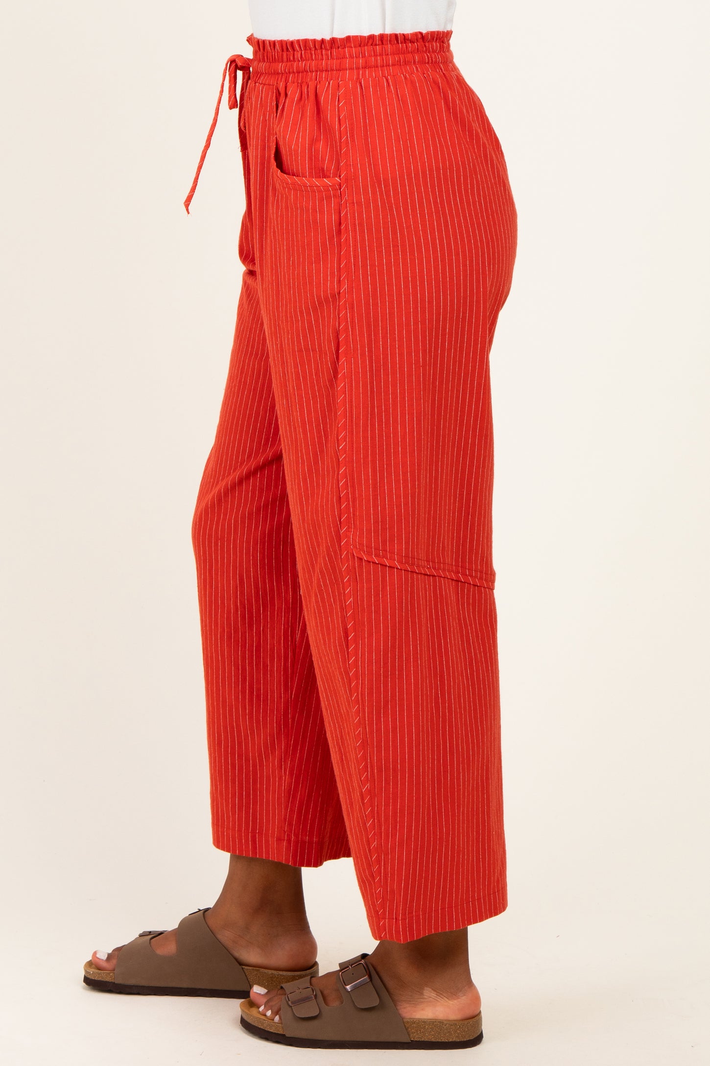 woman wearing red striped wide-leg pants with an elastic waistband and front pockets
