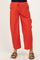woman wearing red striped maternity pants with side pockets and a drawstring waist