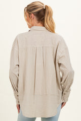 woman wearing a beige striped maternity button-up shirt with a relaxed fit and pleated back detail