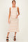 woman wearing a striped maternity dress with a fitted silhouette and a visible baby bump, standing and posing