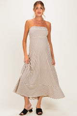 woman wearing a striped strapless maternity dress with a flowing hemline and a relaxed fit