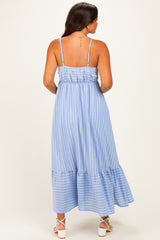 woman wearing a blue and white striped maternity maxi dress with a ruffled hem and adjustable straps