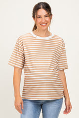 woman wearing a tan and white striped maternity top with short sleeves and a relaxed fit, showing her baby bump