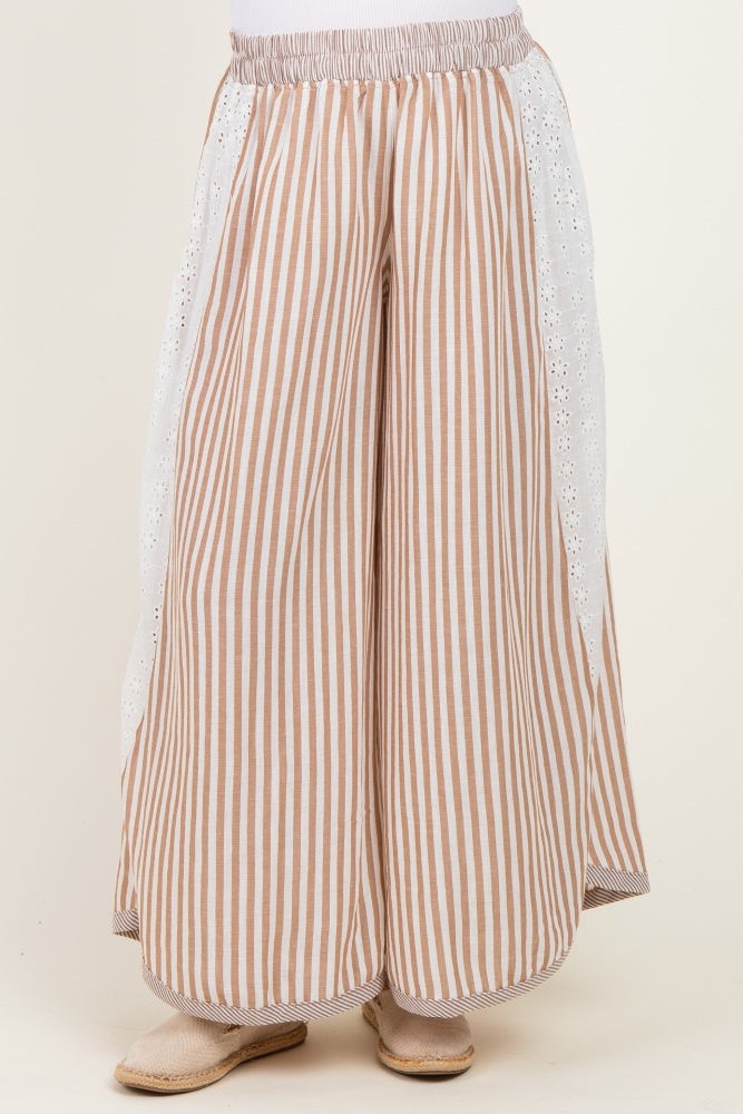 maternity wear featuring striped wide-leg pants with white eyelet lace detail on the sides