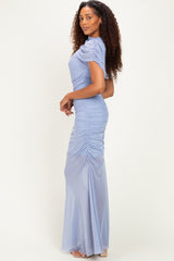 woman wearing a light blue ruched maxi dress with short sleeves and fitted silhouette