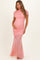 woman wearing a light pink ruched maternity gown with short sleeves and a visible baby bump