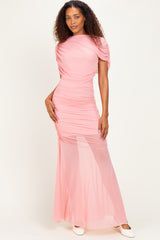 woman wearing a pink ruched maxi dress with short sleeves and a fitted silhouette