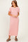 woman wearing a red and white striped short sleeve maxi dress and brown sandals