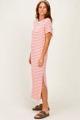 woman wearing a red and white striped maxi dress with short sleeves and side slits
