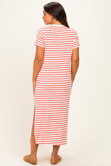 woman wearing a red and white striped maternity maxi dress with a side slit from the back