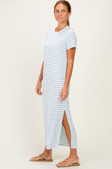 woman wearing a light blue and white striped maxi dress with side slits and short sleeves