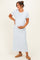 woman wearing a light blue striped maternity maxi dress and holding her baby bump