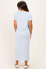 woman wearing a light blue short sleeve maternity maxi dress, viewed from the back