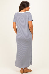 woman wearing a gray striped maternity maxi dress with short sleeves and a relaxed fit, showing a baby bump