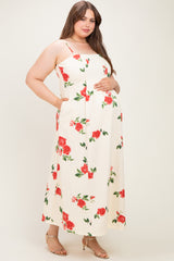 woman wearing a cream floral maternity maxi dress with pockets and a baby bump