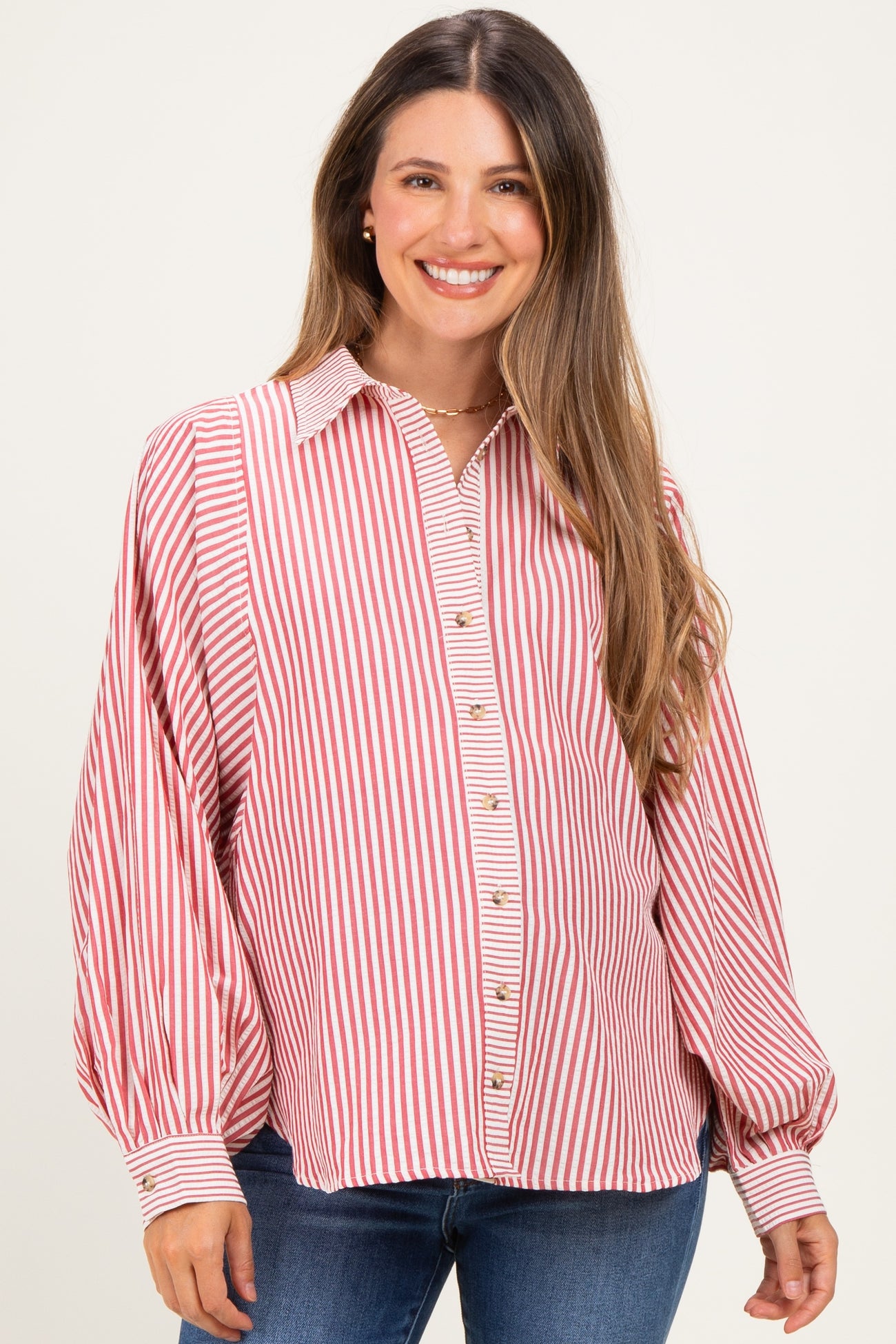 woman wearing a red and white striped maternity button-up shirt with puffy sleeves