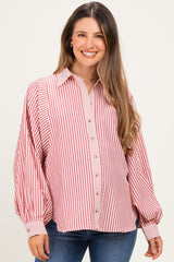 woman wearing a red and white striped maternity button-up shirt with puffy sleeves