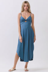 woman wearing a blue spaghetti strap midi dress with a twist front and cut-out detail