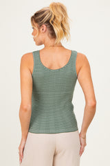 woman wearing a green and white checkered maternity tank top, seen from the back