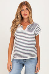 woman wearing a striped short sleeve maternity top with a v-neck and relaxed fit, paired with jeans