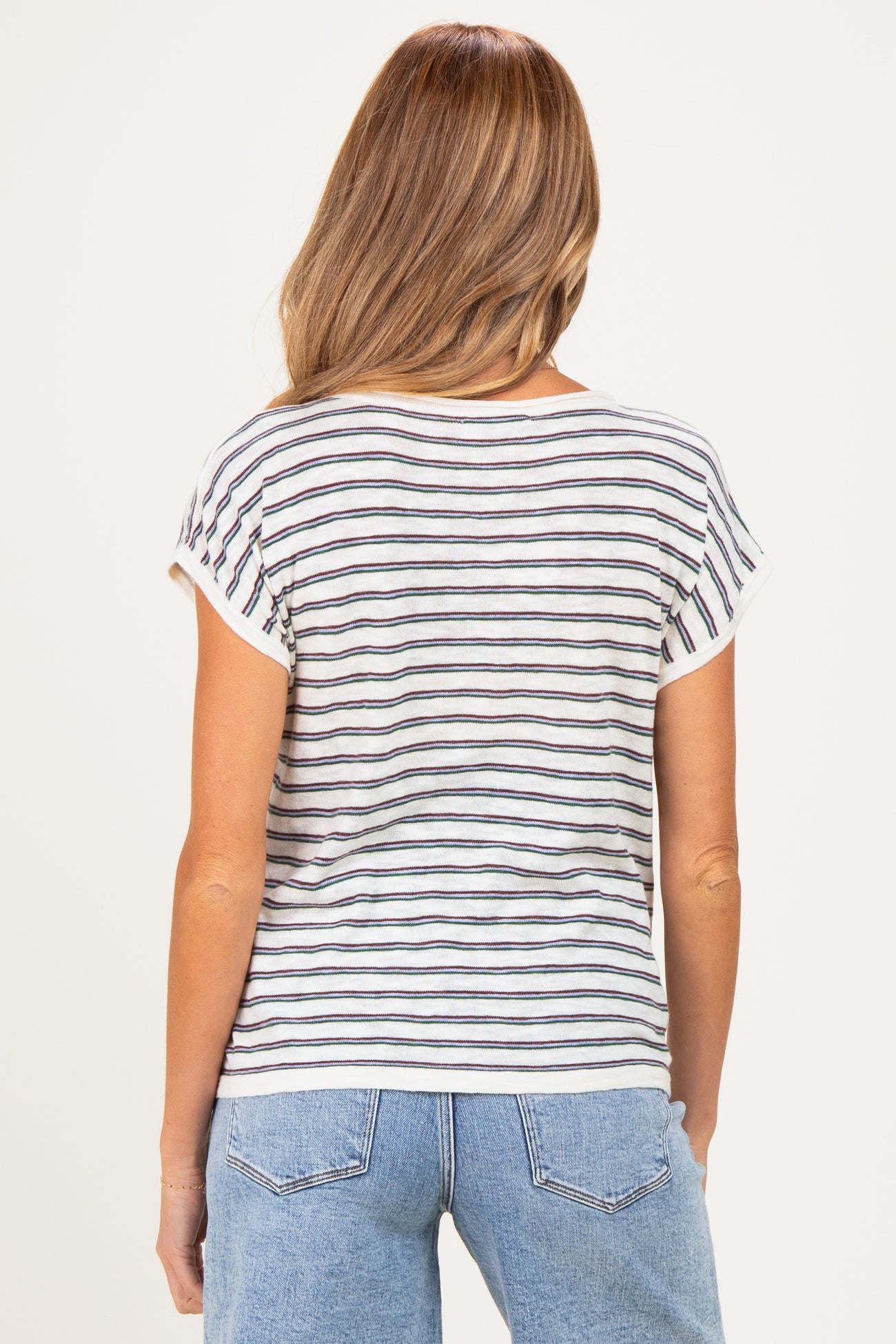 woman wearing a striped short sleeve maternity top with a relaxed fit, viewed from the back