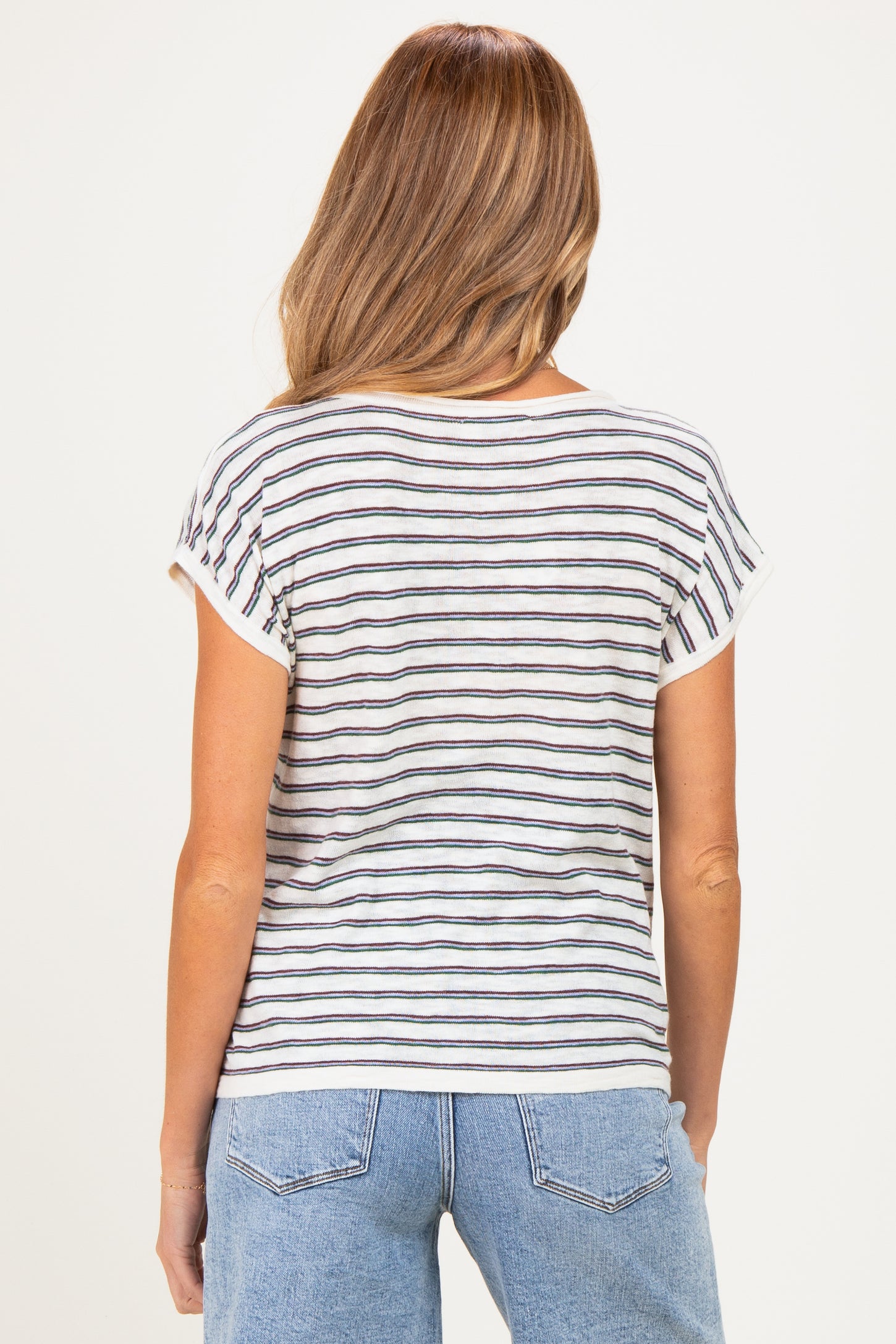 woman wearing a striped short sleeve maternity top with a relaxed fit, viewed from the back