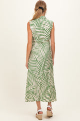 woman wearing a green and white striped sleeveless maternity dress with a tie waist and a flowy skirt, viewed from the back