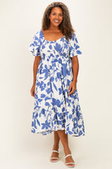 woman wearing a blue and white floral plus-size midi dress with short flutter sleeves and a tiered skirt
