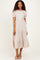 woman wearing a striped short sleeve midi dress with tiered ruffle hem and round neckline