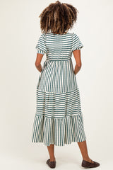 woman wearing a green and white striped maternity maxi dress with short sleeves and tiered ruffles
