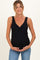 woman wearing a black maternity tank top with a v-neck and holding her baby bump