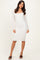 woman wearing a white lace long sleeve bodycon dress with a square neckline and fitted silhouette