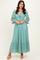 woman wearing a light teal lace maxi dress with a tie front and bell sleeves