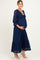 woman wearing a navy blue lace maternity dress with a tie detail and a visible baby bump