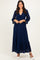 woman wearing a navy blue lace maxi dress with a tie front and bell sleeves