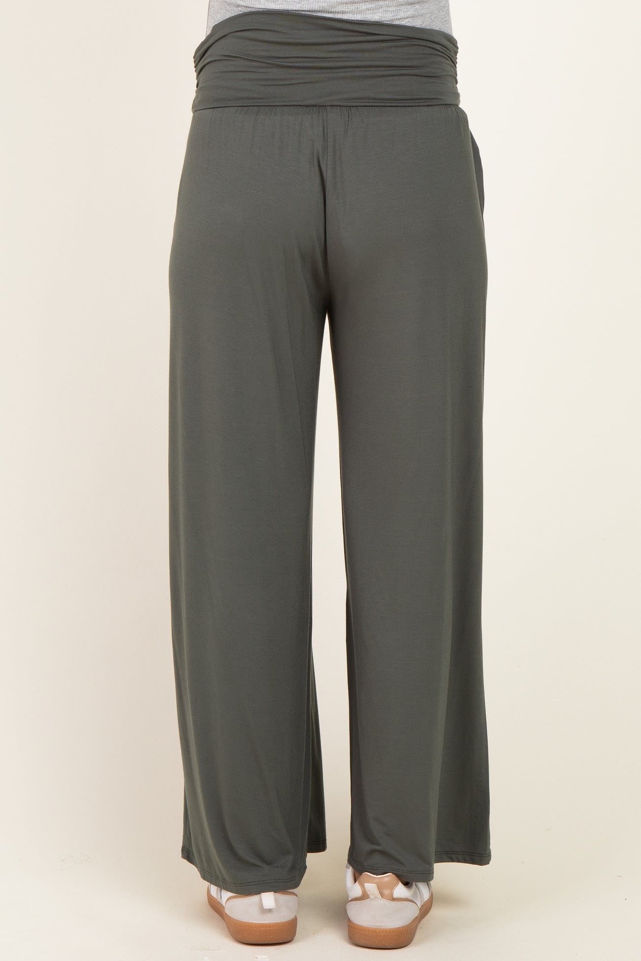 maternity wear in dark green wide-leg pants with a soft waistband, styled without pockets, viewed from the back