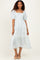 woman wearing a light blue floral puff sleeve midi dress with tiered ruffles and a square neckline