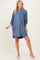 woman wearing a denim button-up maternity dress with rolled sleeves and a casual fit