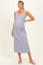 woman wearing a lavender maternity maxi dress with a scoop neckline and button details, showcasing her baby bump