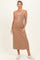 woman wearing a brown ribbed maternity maxi dress with decorative buttons and a baby bump visible