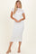 woman wearing a white lace midi dress with a high neckline and short sleeves