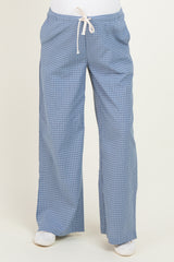 woman wearing light blue maternity plaid pants with an elastic waistband and drawstring