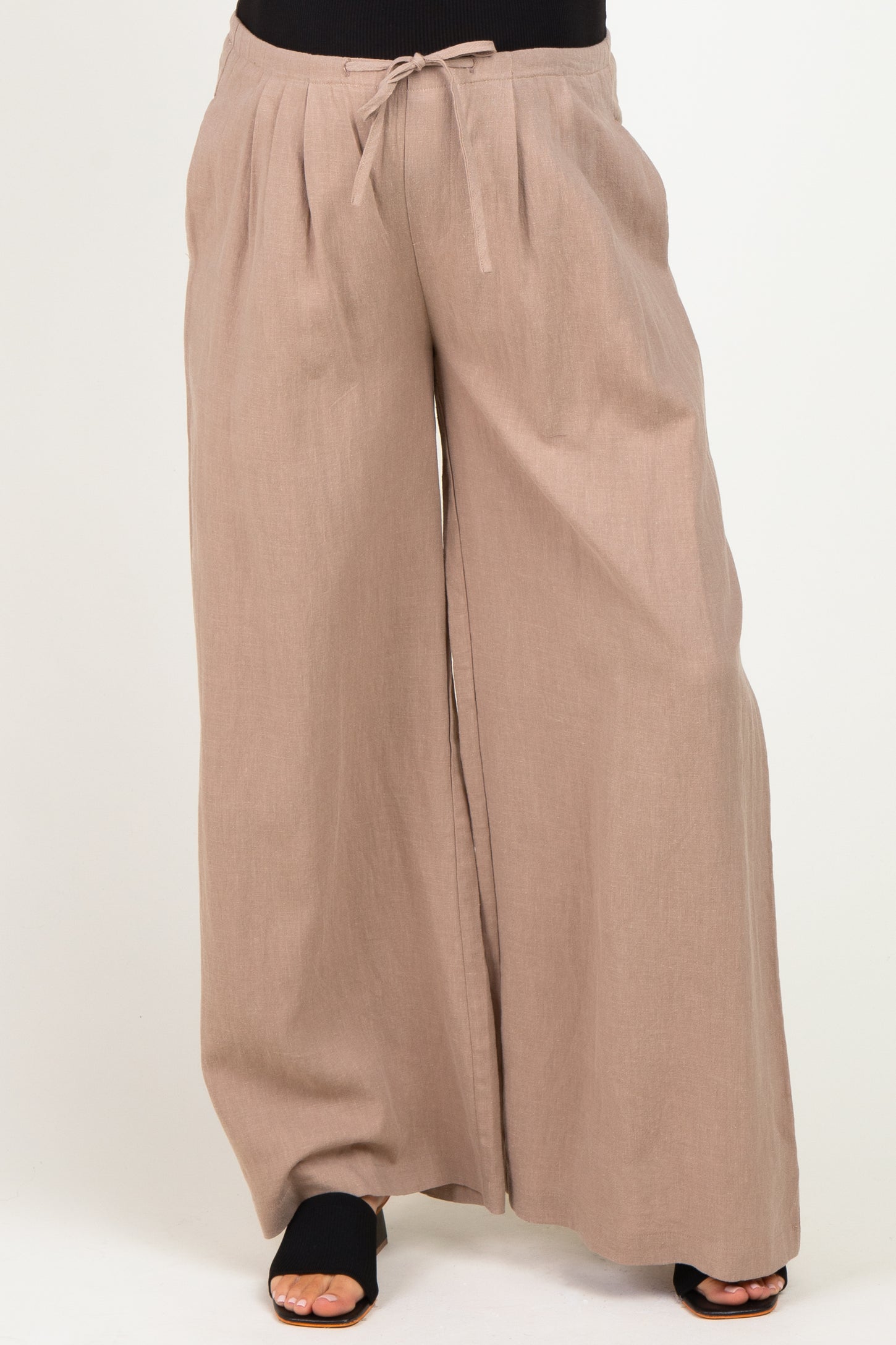 maternity wide-leg linen pants in a soft beige color with a drawstring waist and relaxed fit