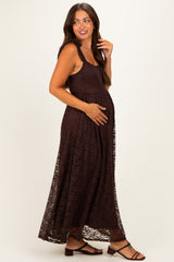 woman wearing a brown lace maternity maxi dress and holding her baby bump