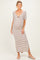 woman wearing a striped maternity maxi dress with a twist front and short sleeves, showing her baby bump