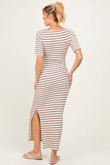 woman wearing a striped maternity maxi dress with short sleeves and a thigh-high slit, showing her back